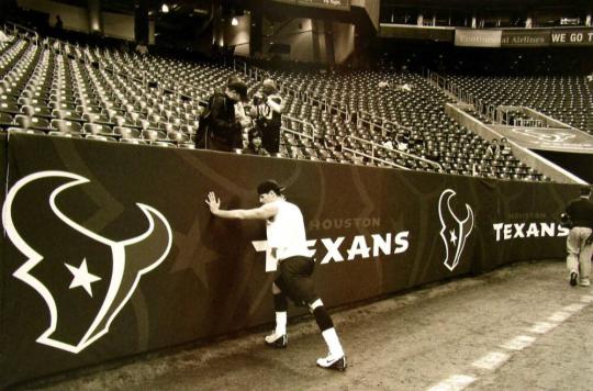 Quarterback David Carr Stretches Before a Game