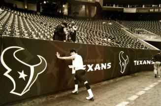 Quarterback David Carr Stretches Before a Game