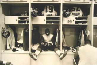 Rookie Guard Fred Weary Reads a Bible Before a Game