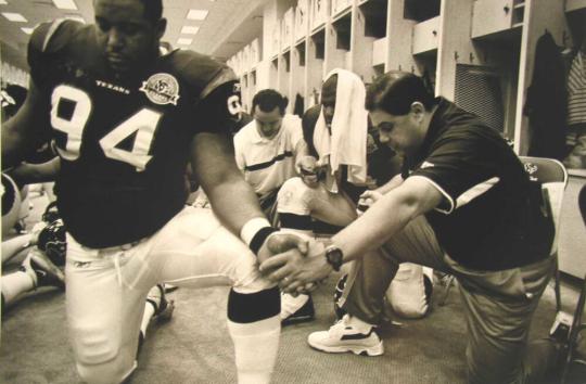 Prayer after Game: Players Charles Hill and Ryan Young and Coaches Everett Coleman and Tony Marciano