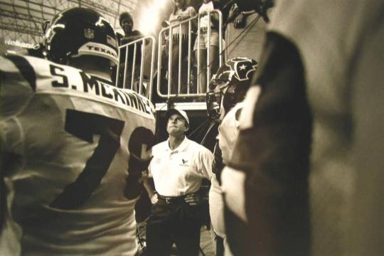 Head Coach Dom Capers and the Texans Wait to Enter the Home Field