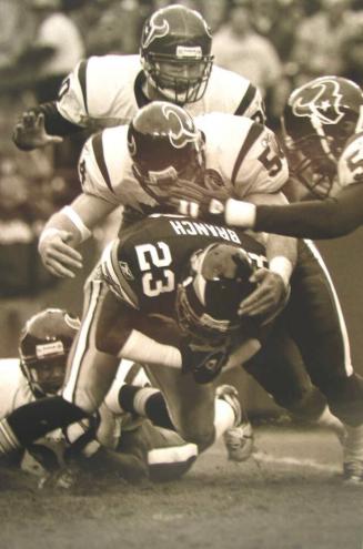 Gang Tackle: Linebackers Troy Evans and Jay Foreman Bring Down Washington Redskins Defensive Back Bruce Branch, Washington, D.C., December, 22, 2002