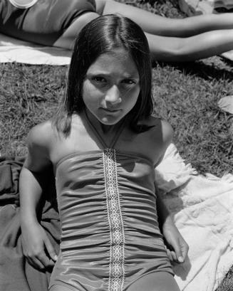 Girl in bathing suit with legs behind at Camp Pinecliffe Maine