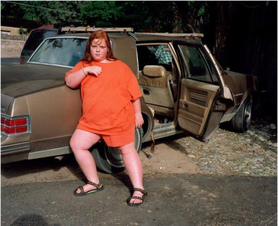 Girl by car at the Tesuque Village Market, Santa Fe, New Mexico