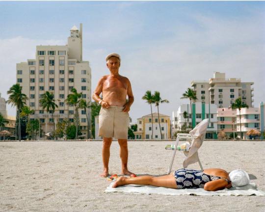 Untitled (Couple on Beach in front of Tides)