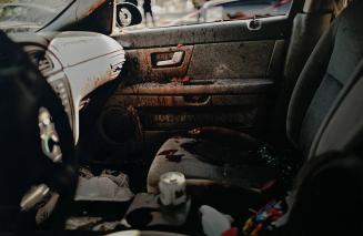 The remains of a car where three undercover federal police officers were executed. Two died inside a car and the other fled but was unable to escape gunmen and died nearby