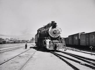 Switch Engine and Switchman Working in the Yard used by the Atchison, Topeka and Santa Fe Railroad, San Bernardino, California