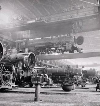 An Engine Being Carried to Another Part of the Atchison, Topeka and Santa Fe Railroad Shops to be Wheeled, Albuquerque, New Mexico