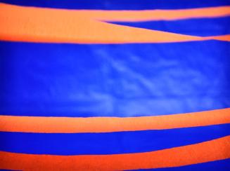 Orange Streamers and Blue Plastic Tablecloth