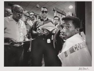 American tennis player Arthur Ashe (1943 - 1993) (right) is interviewed by reporters at the US National Championships, Forest Hills, Queens, New York