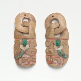 Pair of Deity Head Effigy Pendants