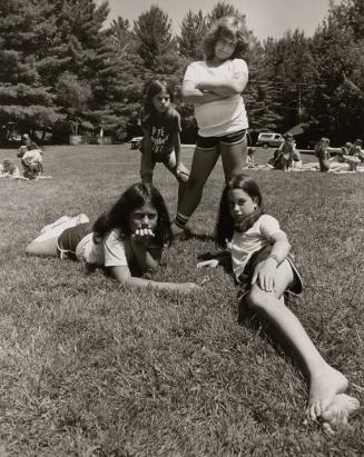 4 girls on lawn at Camp Pinecliffe, Harrison, Maine
