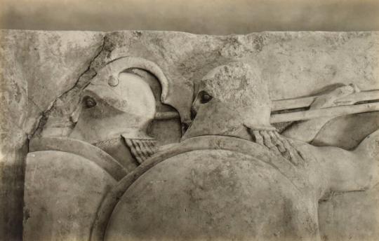 North Frieze. Two Giants with Spears and Shields. Heads.
