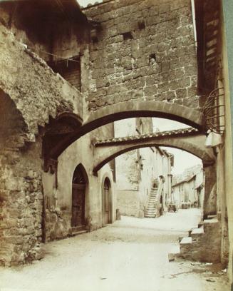 Medieval arch in Poggio Barone street.