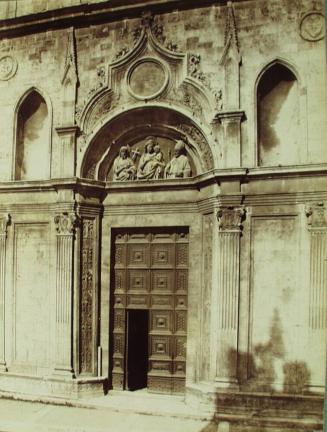 St. Agostino church. The main door. XIV century.