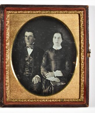 [Man and Woman Holding Book]