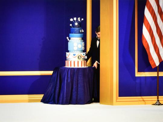 Donald Trump’s inauguration cake is wheeled out to be cut by a sword by President Trump and Vice President Pence. It later caused a stir when it was revealed to be a carbon copy of the cake used for President Obama’s second inauguration.