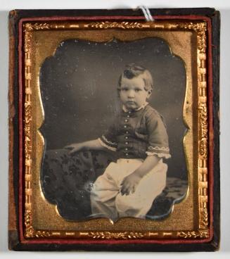 [Young Boy Seated]