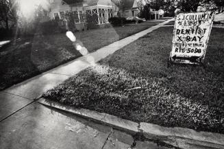 [S.J. Cullum Jr., Dentist Sign on Lawn]