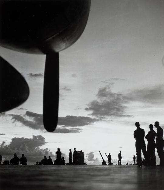 The flight deck of the USS SARATOGA at dawn, as the ship moves in for an air strike against Rabaul