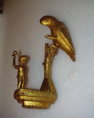 Linguist Staff Finial Representing a Man Throwing a Stone at a Parrot