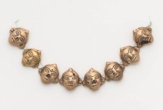 Eight Beads in the Form of Human Heads, Strung Together