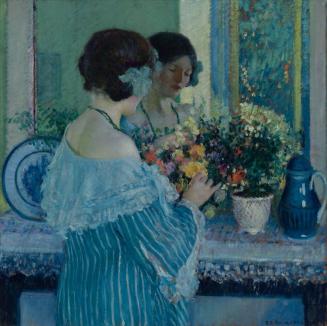Girl in Blue Arranging Flowers