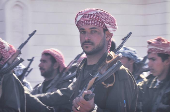 Al-Quds fighters - armed civilians- promise to meet U.S. and British invaders with "bullets, not flowers"