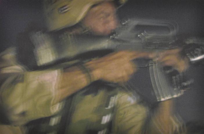 Sgt. Armand Acevedo prepares to return fire, River Road, Ar Ramadi