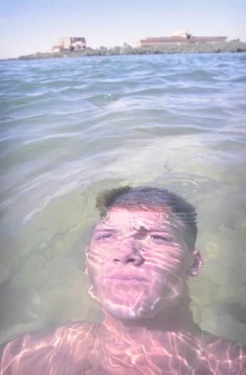 A U.S. soldier swims the south fork of the Euphrates River, Ar Ramadi
