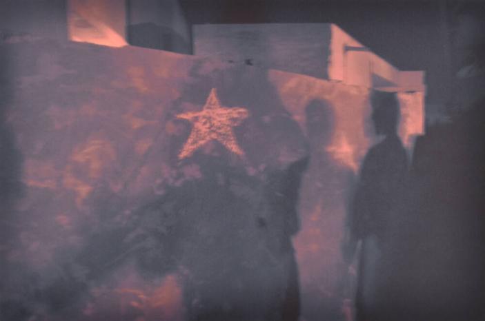 Shadows of Iraqi detainees with U.S. Army captors after curfew, Ar Ramadi