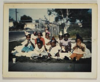 [Group of Young Children at a Picnic Birthday Party, Wearing Party Hats]
