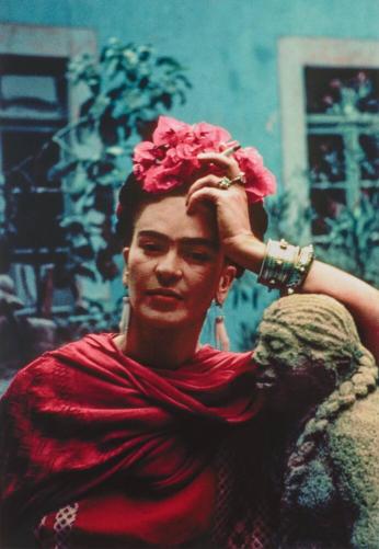 Frida Leaning on a Sculpture by Mardonio Magaña, Coyoacán