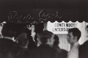 [Copa Joe's Continuous Entertainment Signs Stripper Dancing, Street Crowd Walks By]