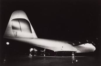 [Howard Hughes’ Spruce Goose Airplane, Woman with Purse]