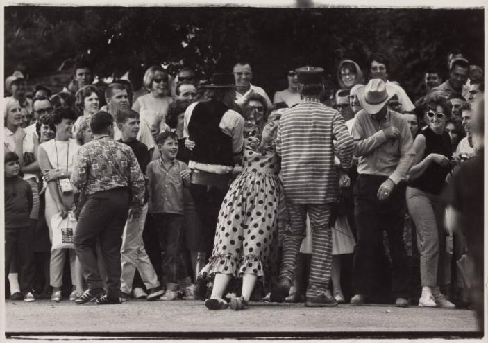 [Parade With Clowns Woman in Polka Dots Man in Jail Stripes Engage the Crowd]