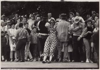 [Parade With Clowns Woman in Polka Dots Man in Jail Stripes Engage the Crowd]