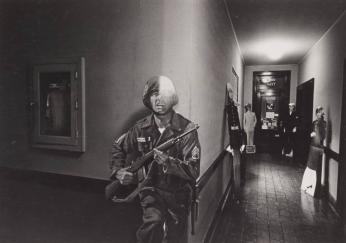 [Cut-Out of Military Personnel in Hallway to Navy Recruitment Office]