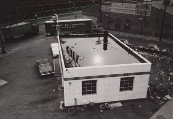 [Looking Down on Gulf Gas Station, Train Car ‘Pottsville Box Corporation Paper Boxes’]