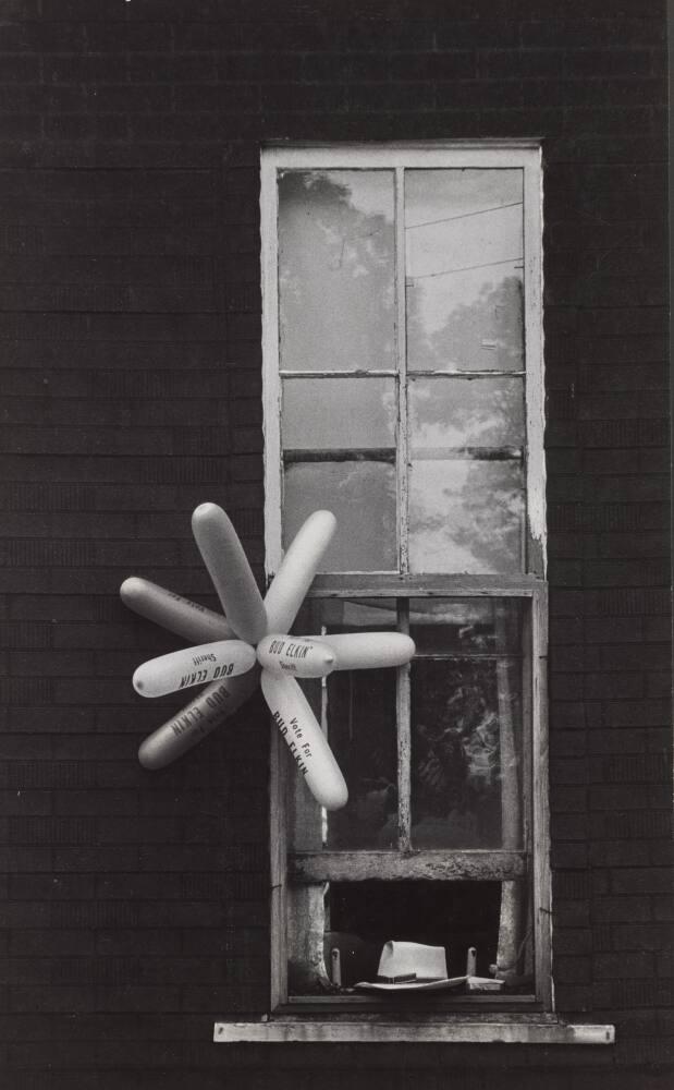 [Eight Balloons Outside Open Window ‘Vote for Bud Elkin Sheriff’, Hat on Windowsill]