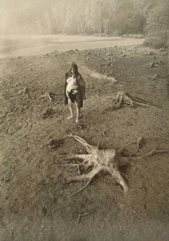 Woman with Tree Trunks