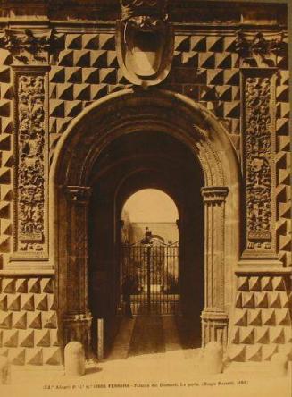 Palazzo entry arch. Iron gate into courtyard.