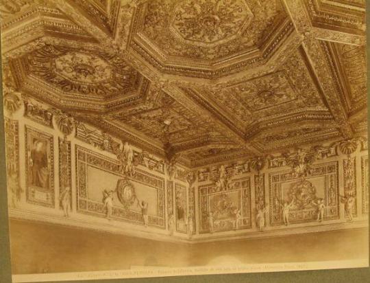 Soffitted ceiling, paneling above doors/windows embellished with winged figures