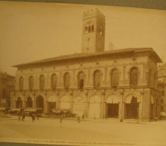 Arched Palazzo w/canvas draping.  Horse-drawn "trollies". Campanille in background.