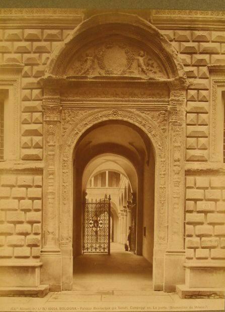 View thru Palazzo arched entry into courtyard - iron gate silhouetted