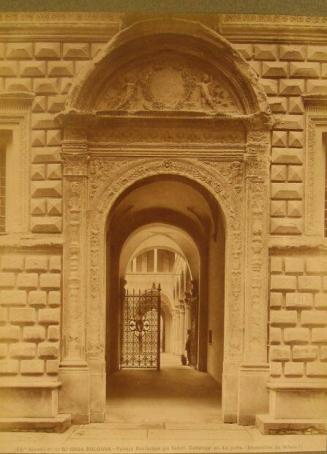 View thru Palazzo arched entry into courtyard - iron gate silhouetted