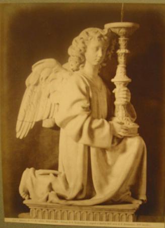 Kneeling angel sculpture