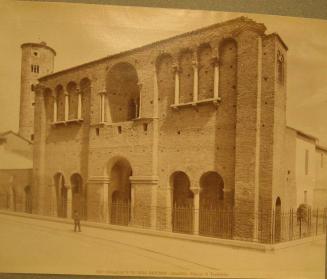 Palazzo - surrounded by iron fence.  Single male figure in front.