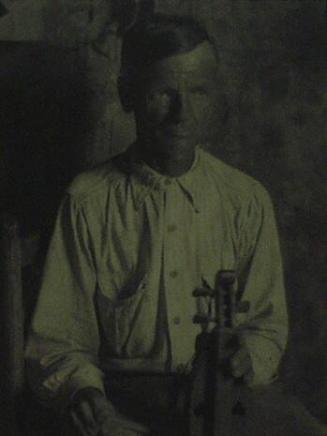 Man with Hand-made Stringed Instrument