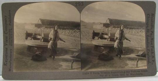 Farm Woman Supervising the Tedious Grinding of a Grain Mill in Manchuria.